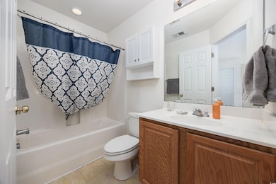 Full bath featuring vanity and shower / bathtub combination with curtain
