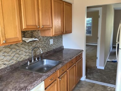 Kitchen with gas stove, refrigerator, dishwasher.