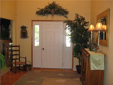 Foyer beautiful hardwood floors and vaulted ceilin