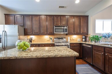 Granite countertops and stained cabinets