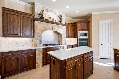 Kitchen featuring light tile patterned floors, dec