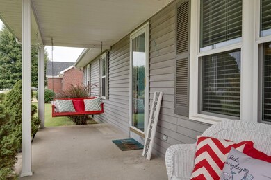 CONCRETE PORCH WITH PLENTY OF ROOM FOR ROCKING CHAIRS
