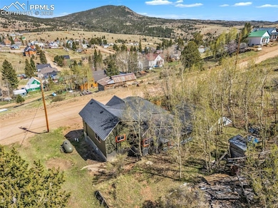 View from above of property featuring treed lot an