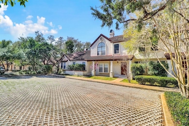 View of front of house with a chimney and a tiled