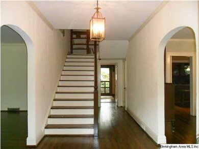 Formal entry, charming arched openings to formal l
