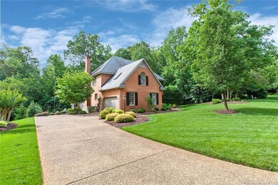 Long Private Driveway With Side Load Garage.