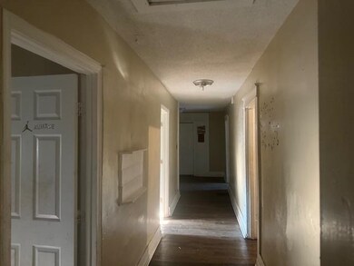 Hall featuring dark hardwood / wood-style flooring