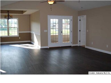 Living room looking toward screened in porch and d