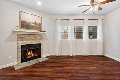 Unfurnished living room with a ceiling fan, baseb