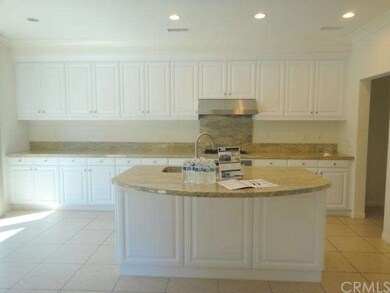 Kitchen with granite countertops and island
