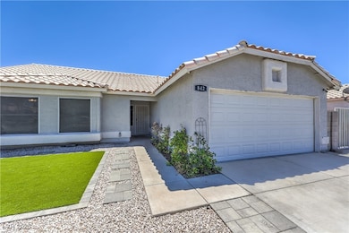 Ranch-style house featuring a tiled roof, stucco s