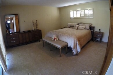 spacious main bedroom with ons