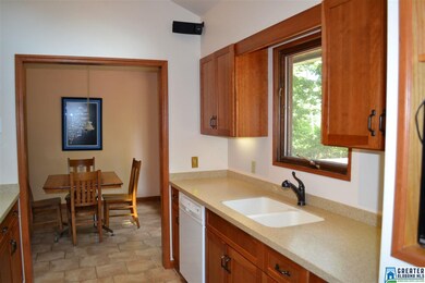Updated kitchen with custom cherry cabinetry and s