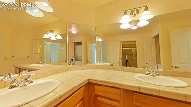 Bathroom featuring stacked washer / drying machine