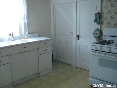 Kitchen. with door to b ment & storage area.