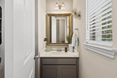 This is a modern, well-lit half-bathroom featuring