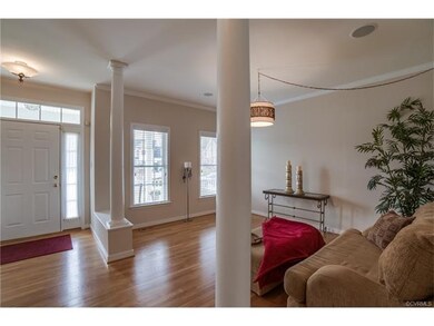 Foyer and Formal Living Room with columns and Hard
