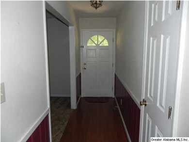 ENTRY FOYER WITH WOOD FLOORS