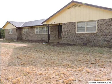 Front of home.  Large yard with partial fenced are