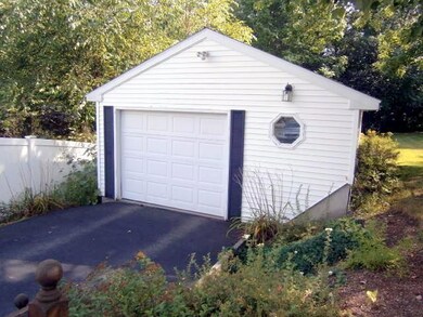 Garage and paved driveway