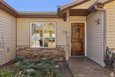 Property entrance with stone siding