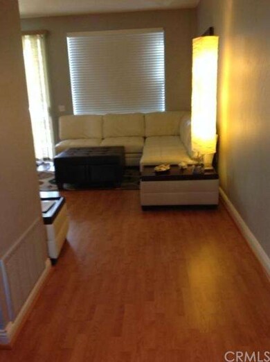 Laminate floor and contrasting paint tones provide