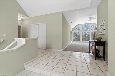 Foyer opens to the great room with gas fireplace, 