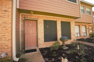 Close up view of the front door and landscaping.