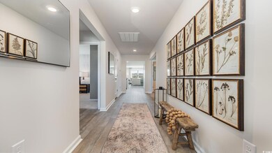 Hall featuring recessed lighting and light wood-style floors