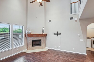 Unfurnished living room with a towering ceiling, 