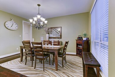 FORMAL DINING ROOM (15 X 11)... Hardwood floors, custom paint in warms tones, two inch blinds, decorative bronze chandelier.