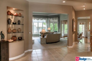 Lovely tiled entry gives visitors a view of the graceful formal dining and living areas, and is full of architectural details to please the most discriminating eye!