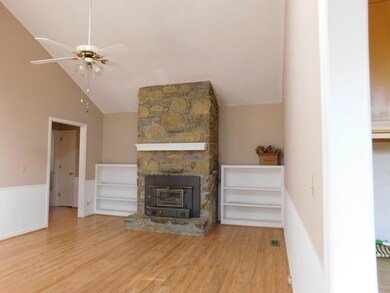 DEN WITH HARDWOOD FLOORING