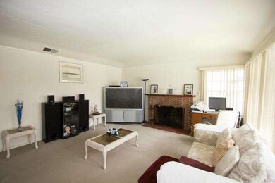 LIVING ROOM WITH COZY FIREPLACE