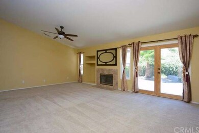 Large Great Room with ceiling fan, custom tile sur