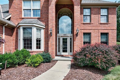 A grand portico entrance exudes timeless elegance.