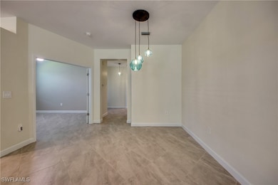 Unfurnished dining area with baseboards