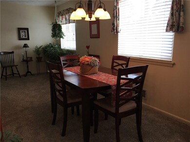 Three windows and this special chandelier make the