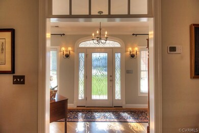 Lovely foyer entryway with transom window.