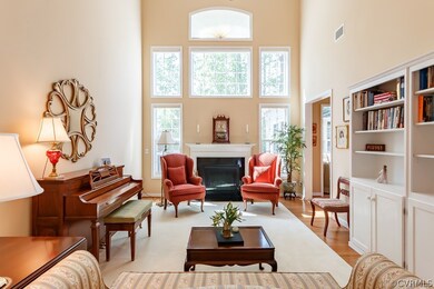 Bright open family room with large windows and bui
