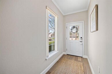 Doorway to outside featuring wood finished floors