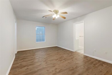 Primary bedroom with attached bath and closet