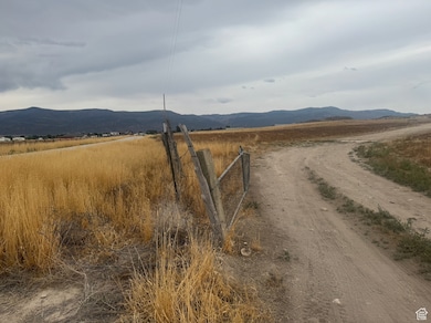 View of mountain backdrop featuring rural landscape
