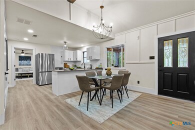 The dining room and kitchen both feature designer