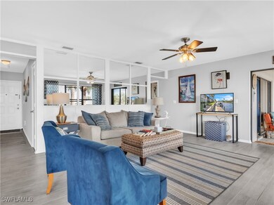 Living room featuring visible vents, wood finished