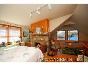 FIREPLACE IN BEDROOM WITH VIEW