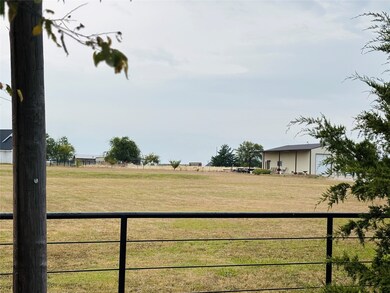 Tree line across the front of property
