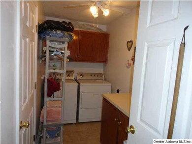 Large laundry room with cabinetry.