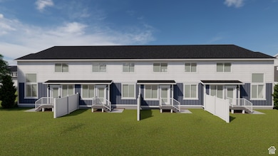 Rear view of property with board and batten siding and a lawn