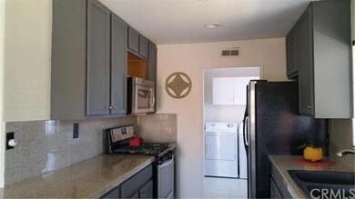 Kitchen w/granite and stainless steel/inside laund